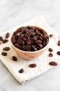 Organic Dried Chilean Dark Raisins in a Bowl, side view Royalty Free Stock Photo