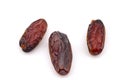 Three organic Medjool dried date fruits isolated on white background Royalty Free Stock Photo