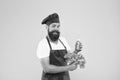 Organic eco vegan products. bearded man chef in apron and hat. hipster decide what to choose. healthy eating and dieting Royalty Free Stock Photo