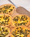 Organic egg and vegetable tarts display at a local farmers market Royalty Free Stock Photo