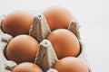 organic eggs in egg box on white marble kitchen table Royalty Free Stock Photo