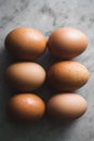 Organic eggs, group shot still life in soft moody light placed on marble background