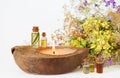 Organic essential aroma oils in glass bottles, medicine herbs and eco candle. Selective focus Royalty Free Stock Photo