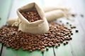 organic fair trade coffee beans spread on a burlap sack Royalty Free Stock Photo