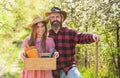 Organic farm. Smiling couple in love gardening. Girl hold box with pots and tools. Farming season. Happy couple ranch Royalty Free Stock Photo