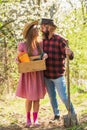 Organic farm. Smiling couple in love gardening. Girl hold box with pots and tools. Soils and fertilizers. Planting Royalty Free Stock Photo