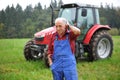 Farmer and his Red Tractor Royalty Free Stock Photo