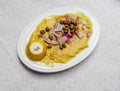 Organic `fava` split peas puree Greek gourmet plate with onion, caperi, lemon and olive olive