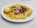 Organic fava split peas puree Greek gourmet plate with onion, capers, lemon and olive oil.