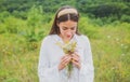 Organic field. Spring girl in field. Healthy lifestyle. Woman in meadow with wildflowers.