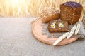 Organic food - bread lying on the table, against the background of a wheat field. Agricultural with food background Royalty Free Stock Photo