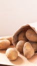 Organic food concept organic fresh potatoes in paper bag on wood Royalty Free Stock Photo