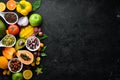 Organic food. Fruits, vegetables, beans and nuts on a black stone background. Top view. Royalty Free Stock Photo