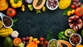 Organic food. Fruits, vegetables, beans and nuts on a black stone background. Top view. Royalty Free Stock Photo