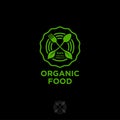 Organic food logo. Green food emblem. Green leaves, fork and spoon in a circle.