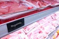 Organic food signage on modern supermarket fresh chilled meat ai Royalty Free Stock Photo