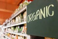 Organic food signage on modern supermarket grocery aisle Royalty Free Stock Photo