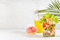 Organic food take away - lunch set of orange juice, pink donut, fresh sea food salad with shrimps, vegetables, red pepper, lettuce Royalty Free Stock Photo