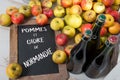 organic fresh apples and bottle of Normandy cider with chalkboard