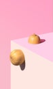 Organic fresh butter squash seats on the corner of the table. Pastel coral, pink and beige background. Still life abstract