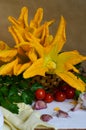 Organic and fresh courgette and zucchini flowers, summer harverst on wooden table Royalty Free Stock Photo