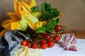 Organic and fresh courgette and zucchini flowers, summer harverst on wooden table Royalty Free Stock Photo