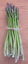 Organic fresh green asparagus bunch from a farmers market tied i Royalty Free Stock Photo