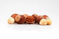 Organic and fresh shelled and unshelled hazelnuts on white background Royalty Free Stock Photo