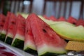 Organic fresh sliced watermelon and melon on a white tray Royalty Free Stock Photo