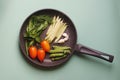 Organic fresh vegetables courgette, tomato, asparagus, basil, dill, green peas, garlic in a frying pan Royalty Free Stock Photo