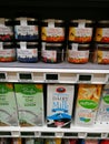 Organic fruit jam and dairy milk, supermarket shelf Royalty Free Stock Photo