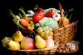 Organic fruit and vegetable in wicker basket on table Royalty Free Stock Photo