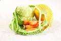 Organic fruit and vegetables in a eco cotton string bag on a grey background