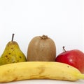 Organic fruits. Closeup apple, pear, kiwi, orange and banana on a white background with place for your text. Royalty Free Stock Photo