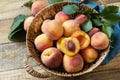 Organic fruits. Fall harvest background. Farmer\'s market. Basket of ripe peaches on a rustic wooden table Royalty Free Stock Photo