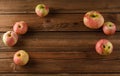 Organic fruits. Tasty imperfect apples on old wooden background