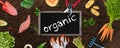 Organic Garden banner illustration - garden tools and organic vegetables on brown land Royalty Free Stock Photo