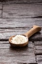 Hydrolyzed collagen protein in spoon - Rustic wooden background