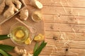 Organic ginger infusion on wooden table in the field top