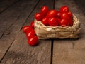 Organic grape tomatoes on a wooden table