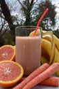 Organic grapefruit carrot banana shake Royalty Free Stock Photo