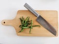 Organic green beans on a wooden chopping board and a knife . Cooking healthy vegetables Royalty Free Stock Photo