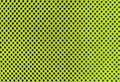 Organic green breathable porous poriferous material for air ventilation with holes. tropical lime sportswear texture