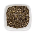 Organic Green tea (Camellia sinensis) Tea bag cut, dried leaves. Royalty Free Stock Photo