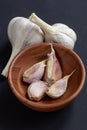 Organic grown garlic in a wooden bowl Royalty Free Stock Photo