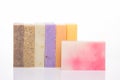 Organic handmade soap concept. Photo of a row of homemade colorful soap bars isolated on white background Royalty Free Stock Photo
