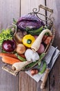 Organic healthy vegetables in the rustic basket Royalty Free Stock Photo