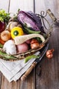 Organic healthy vegetables in the rustic basket Royalty Free Stock Photo