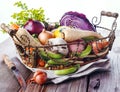 Organic healthy vegetables in the rustic basket Royalty Free Stock Photo