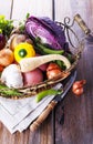 Organic healthy vegetables in the rustic basket Royalty Free Stock Photo